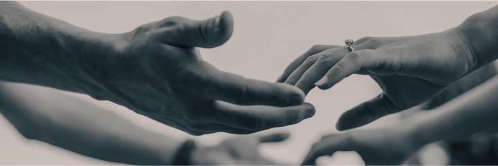 Pair of hands reaching out to another pair